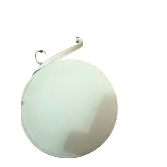 Cynthia Crowley round crossbody purse featuring a playful retro daisy design. - Picture 2 of 4